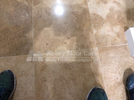 Travertine holes filled with colour-matched repair material before polishing